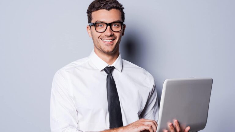a man holding a laptop