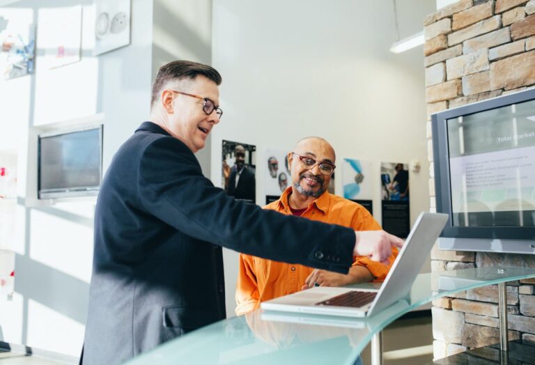 businessman pointing at laptop