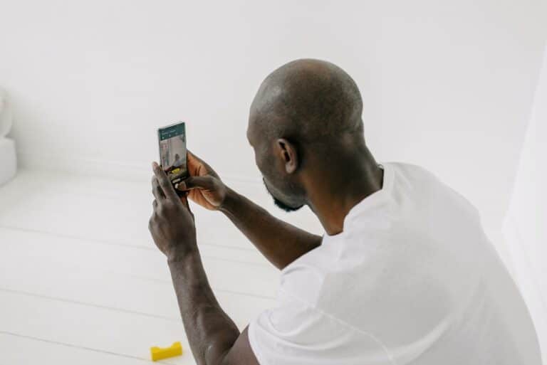 man shooting a video using smartphone
