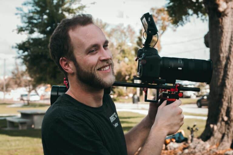person holding a video camera